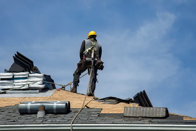 Roofing contractor at work